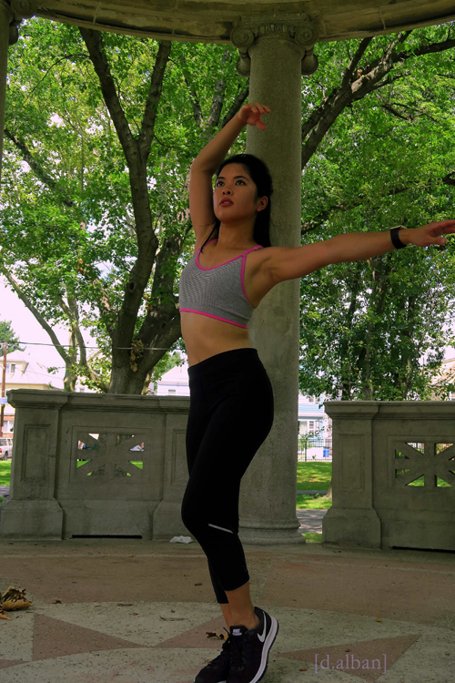 Concentrating On Keeping Her Balance, Krystelle Stretches In The Gazebo At The Bayonne Park